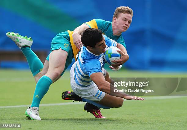 Matias Moroni of Argentina scores a try during the Men's Rugby Sevens placing 5-8 match between Argentina and Australia on Day 6 of the Rio 2016...