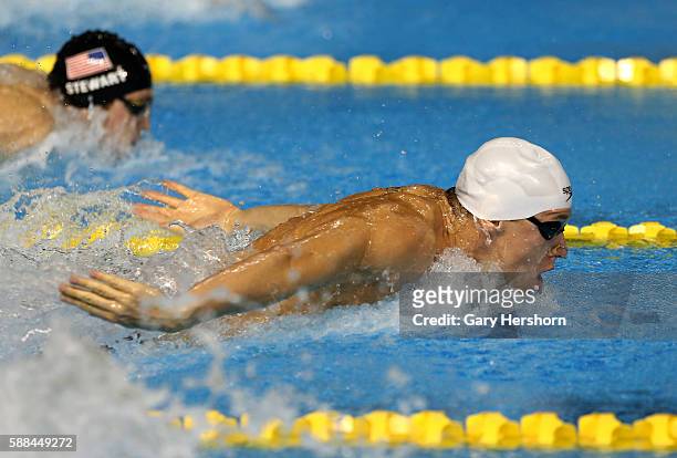 Henrique Rodrigues of Brazil swims the butterfly stroke on his way to a gold medal in the men's 200m individual medley final at the Toronto 2015...
