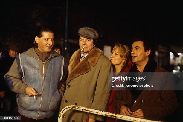 French humorist and actor Patrick Sebastien, director Jean-Pierre Mocky, actress Pauline Lafont and actor Richard Bohringer during the filming of...