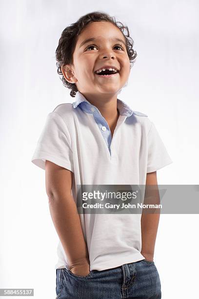 portrait of laughing young boy. - boy white background stock-fotos und bilder