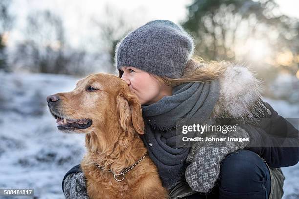 woman with dog - animals in clothes stock-fotos und bilder