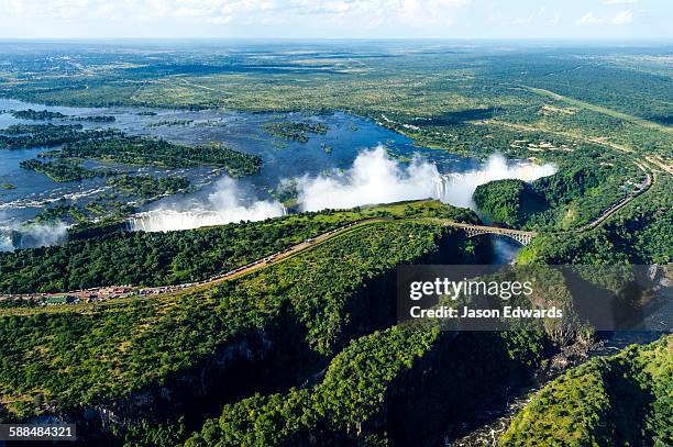 an aerial view of a winding gorge carved into a flat plain by the zambezi river. - zambia stockfoto's en -beelden
