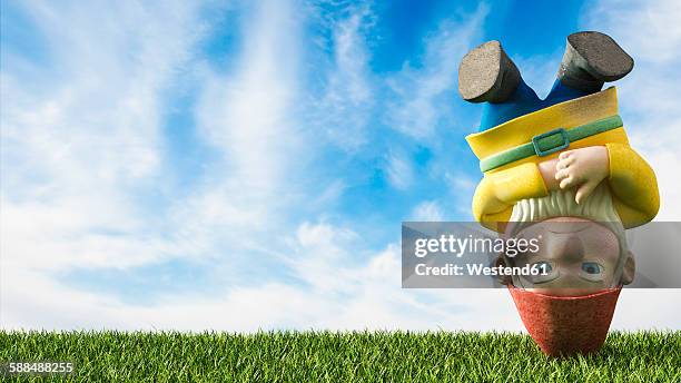 garden gnome head first on a meadow, 3d rendering - garden gnome stock illustrations