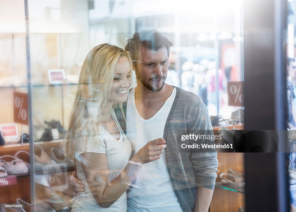 Portrait of smiling young couple on shopping tour