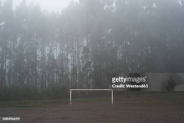 spain, muddy soccer field in winter - muddy football pitch stock pictures, royalty-free photos & images