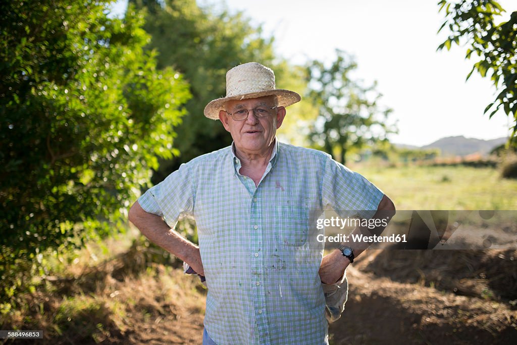 Portrait of farmer with hands on his hips