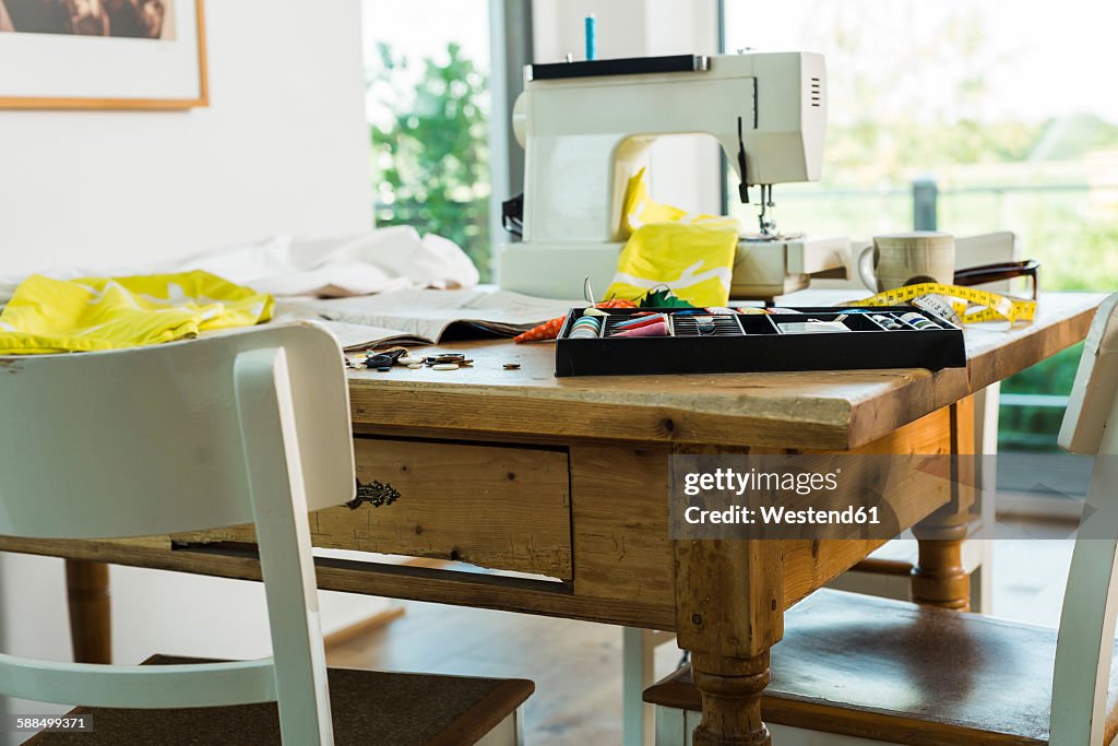 Sewing machine on wooden table
