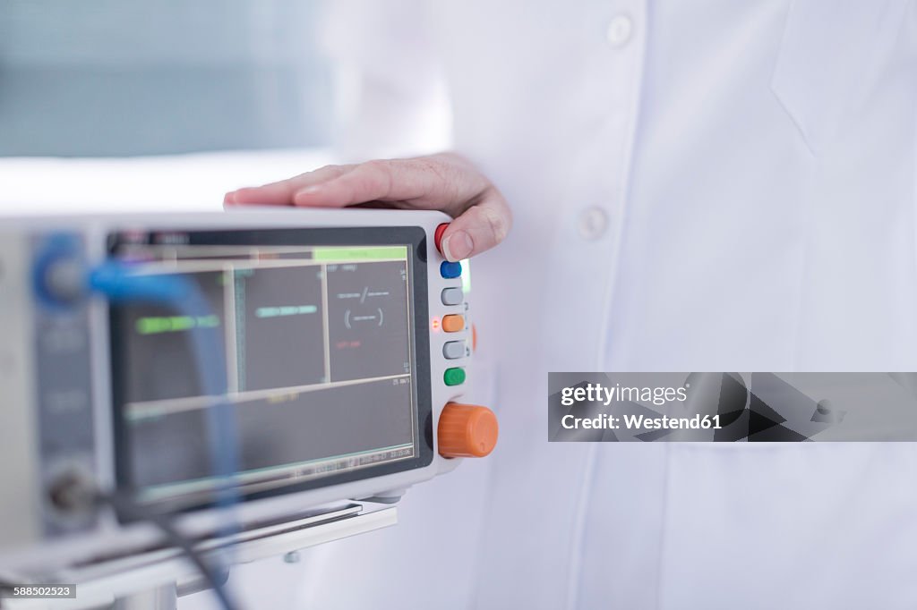 Close-up of doctor and patient monitor