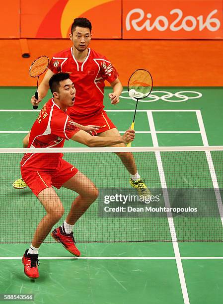 Chai Biao and Hong Wei of China compete against Kenichi Hayakawa Hiroyuki Endo of Japan in the badminton Mens Doubles on Day 6 of the 2016 Rio...