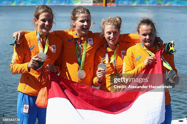 Chantal Achterberg, Nicole Beukers, Inge Janssen, and Carline Bouw of the Netherlands pose after winning the silver medal in the Women's Quadruple...