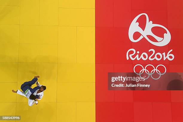 Ryunosuke Haga of Japan competes with Beka Gviniashvili of Georgia during the men's -100kg repechage judo contest on Day 6 of the 2016 Rio Olympics...