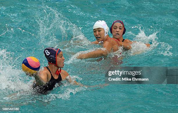 Kiley Neushul of United States passes during a Womens Preliminary match against China on Day 6 of the 2016 Rio Olympics at Maria Lenk Aquatics Centre...