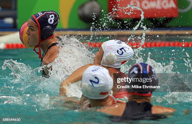 Kiley Neushul of United States and Guannan Niu of China fight for the ball during a Womens Preliminary match on Day 6 of the 2016 Rio Olympics at...