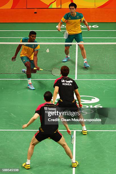 Sawan Serasinghe and Matthew Chau of Australia compete against Nan Zhang and Lee Yong-dae and Yoo Yeon Seong of South Korea in the Mens Doubles on...