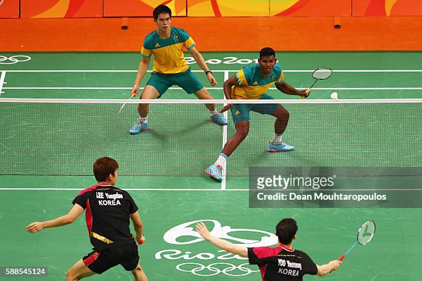 Sawan Serasinghe and Matthew Chau of Australia compete against Nan Zhang and Lee Yong-dae and Yoo Yeon Seong of South Korea in the Mens Doubles on...
