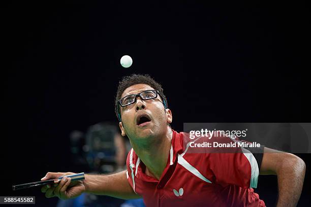 Summer Olympics: Closeup of Egypt Omar Assar in action during Men's Round 2 match vs Ukraine Kou Lei at Riocentro. Assar looking up at ball above...