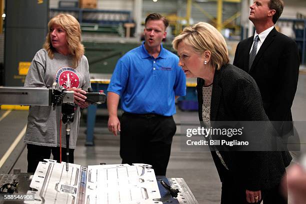 Democratic presidential nominee Hillary Clinton tours Futuramic Tool & Engineering before giving a speech there on the U.S. Economy August 11, 2016...