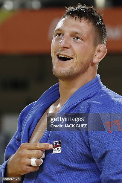 Czech Republic's Lukas Krpalek celebrates after defeating France's Cyrille Maret during their men's -100kg judo contest semifinal B match of the Rio...