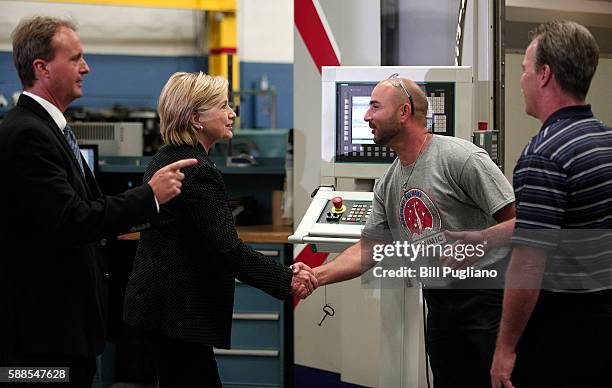 Democratic presidential nominee Hillary Clinton tours Futuramic Tool & Engineering before giving a speech there on the U.S. Economy August 11, 2016...