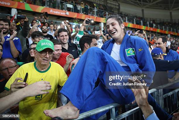 Mayra Aguiar of Brazil celebrates after defeating Yalennis Castillo of Cuba during the women's -78kg bronze medal judo contest on Day 6 of the 2016...