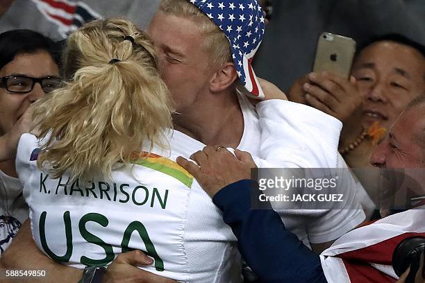 Kayla Harrison celebrates after defeating France's Audrey Tcheumeo during their women's -78kg judo contest gold medal match of the Rio 2016 Olympic...
