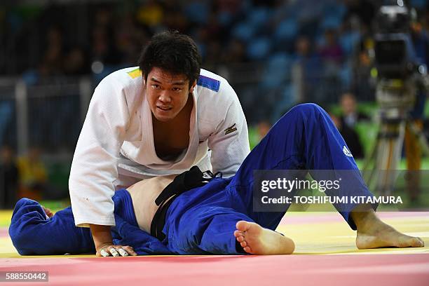 Japan's Ryunosuke Haga competes with Ukraine's Artem Bloshenko during their men's -100kg judo contest bronze medal B match of the Rio 2016 Olympic...