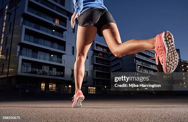 young woman jogging in urban location. - low section woman stock pictures, royalty-free photos & images