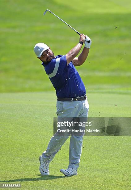 Spaun hits his second shot on the ninth hole during the first round of the Web.com Tour Price Cutter Charity Championship presented by Dr Pepper at...