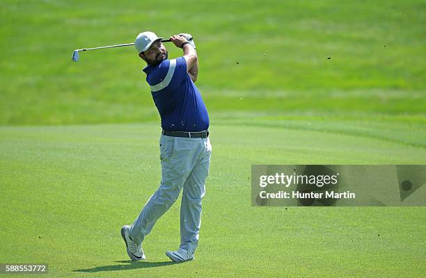 Spaun hits his second shot on the ninth hole during the first round of the Web.com Tour Price Cutter Charity Championship presented by Dr Pepper at...