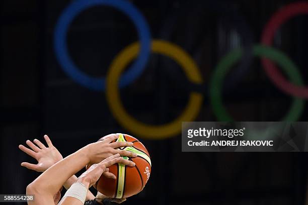 PLayers go for the ball during a Women's round Group A basketball match between Japan and Australia at the Youth Arena in Rio de Janeiro on August...