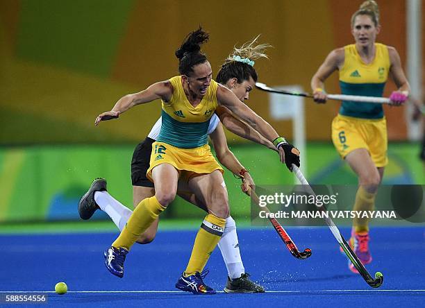 Australia's Madonna Blyth and Argentina's Agustina Albertarrio collide during the women's field hockey Australia vs Argentina match of the Rio 2016...