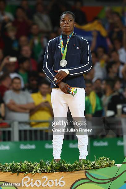 Silver medalist, Audrey Tcheumeo of France celebrates on the podium during the women's -78kg gold medal judo contest against Kayla Harrison of the...