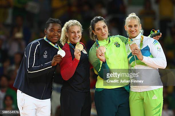 Silver medalist Audrey Tcheumeo of France, gold medalist Kayla Harrison of the United States and bronze medalists Mayra Aguiar of Brazil and Anamari...