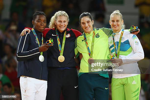 Silver medalist Audrey Tcheumeo of France, gold medalist Kayla Harrison of the United States and bronze medalists Mayra Aguiar of Brazil and Anamari...