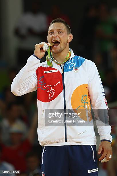 Gold medalist, Lukas Krpalek of the Czech Republic celebrates on the podium after the men's -100kg gold medal judo contest against Elmar Gasimov of...