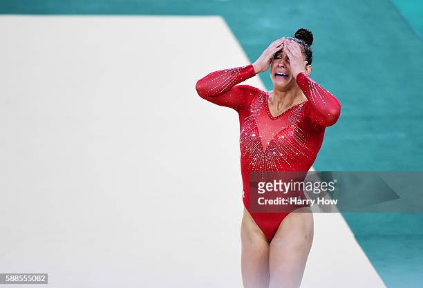 Alexandra Raisman of the United States reacts after competing on the floor during the Women's Individual All Around Final on Day 6 of the 2016 Rio...