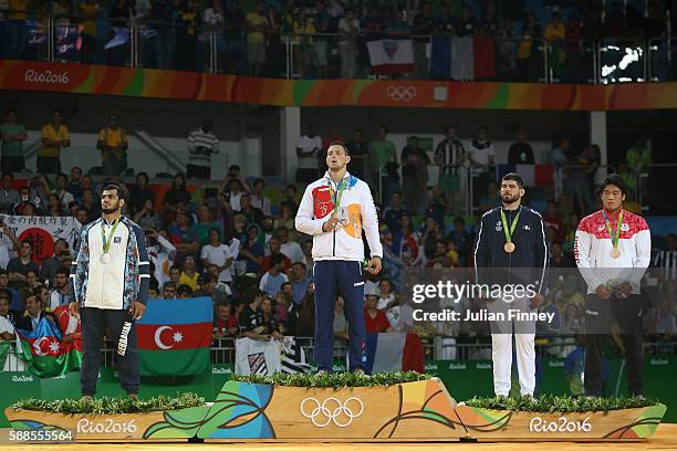 Silver medalist Elmar Gasimov of Azerbaijan, gold medalist Lukas Krpalek of the Czech Republic and bronze medalists Cyrille Maret of France and...