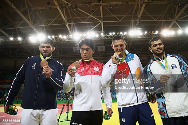 Silver medalist Elmar Gasimov of Azerbaijan, gold medalist Lukas Krpalek of the Czech Republic and bronze medalists Cyrille Maret of France and...