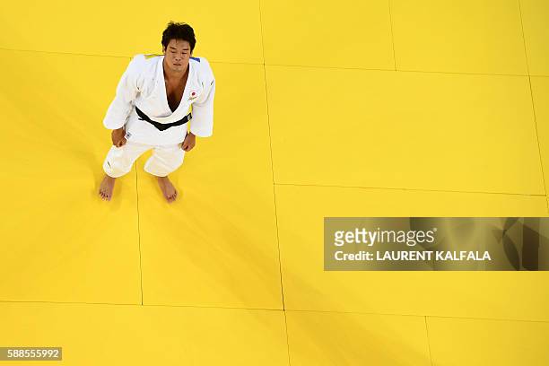 Japan's Ryunosuke Haga reacts after defeating Ukraine's Artem Bloshenko during their men's -100kg judo contest bronze medal B match of the Rio 2016...