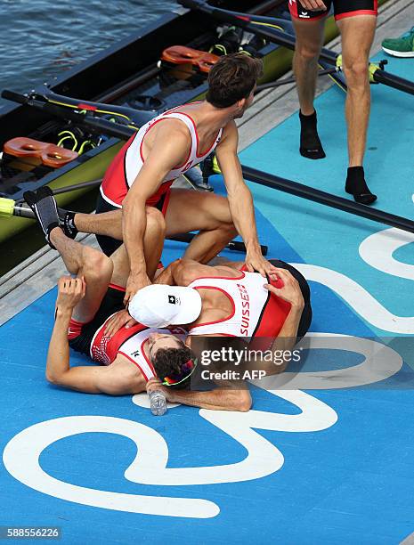 Switzerland's Mario Gyr, Switzerland's Simon Schuerch, Switzerland's Simon Niepmann and Switzerland's Lucas Tramer celebrate at the end of the LWT...