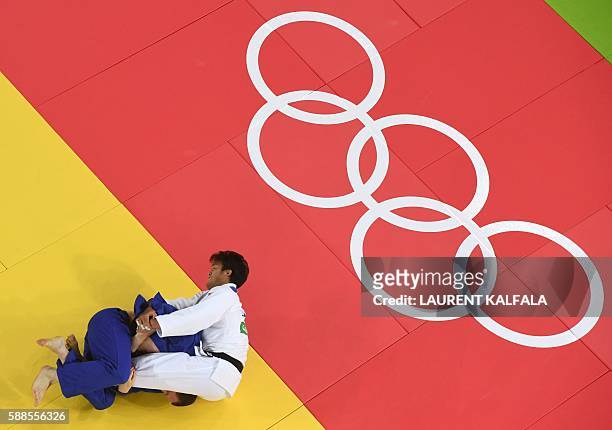 Japan's Ryunosuke Haga competes with Ukraine's Artem Bloshenko during their men's -100kg judo contest bronze medal B match of the Rio 2016 Olympic...