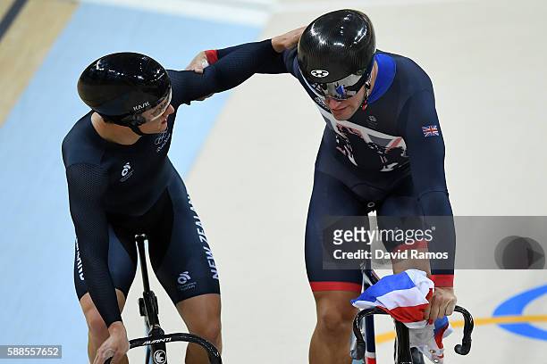 Edward Dawkins of New Zealand congratules Philip Hindes of Great Britain after Team GB wins gold and get an Olympic record in the Men's Team Sprint...