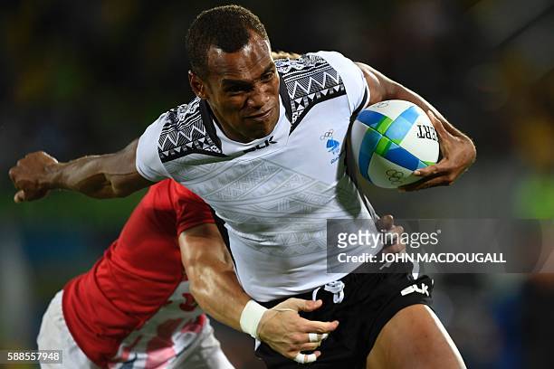 Fiji's Osea Kolinisau scores a try in the mens rugby sevens gold medal match between Fiji and Britain during the Rio 2016 Olympic Games at Deodoro...