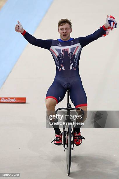 Philip Hindes of Great Britain celebrates after winning gold and getting an Olympic record in the Men's Team Sprint Track Cycling Finals on Day 6 of...