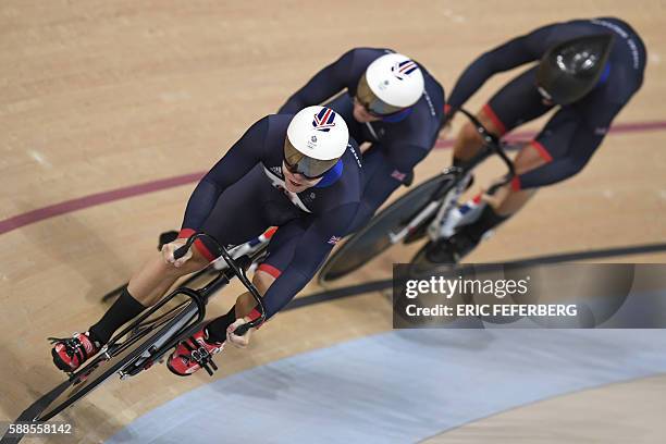 Britain's Philip Hindes, Britain's Jason Kenny and Britain's Callum Skinner compete in the men's Team Sprint track cycling finals at the Velodrome...