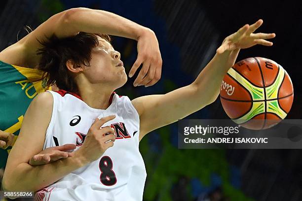 Japan's power forward Maki Takada and Australia's centre Marianna Tolo fail to catch a rebound during a Women's round Group A basketball match...