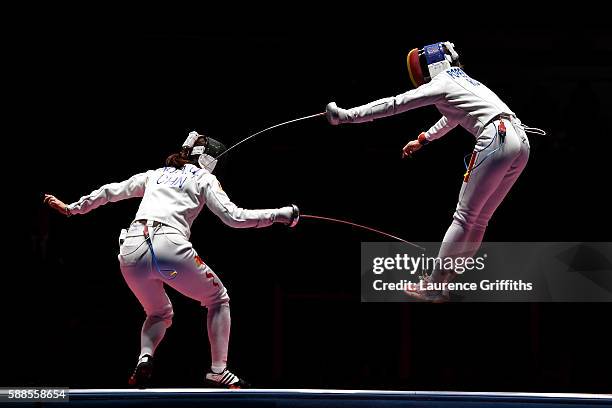 Ana Maria Popescu of Romania competes against Anqi Xu of China during the Women's Epee Team Gold Medal Match bout on Day 6 of the 2016 Rio Olympics...