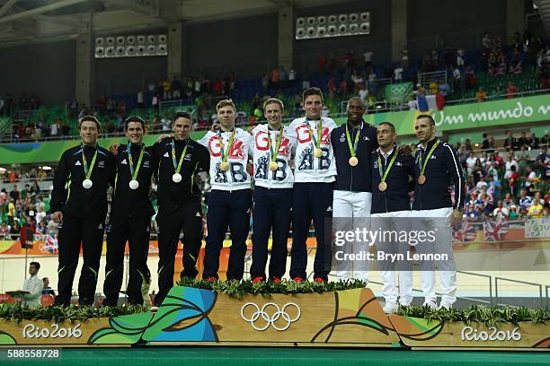 Silver medalists Edward Dawkins, Sam Webster and Ethan Mitchell of New Zealand, gold medalists Philip Hindes, Jason Kenny and Callum Skinner of Great...