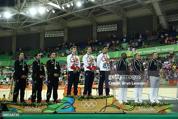 Silver medalists Edward Dawkins, Sam Webster and Ethan Mitchell of New Zealand, gold medalists Philip Hindes, Jason Kenny and Callum Skinner of Great...