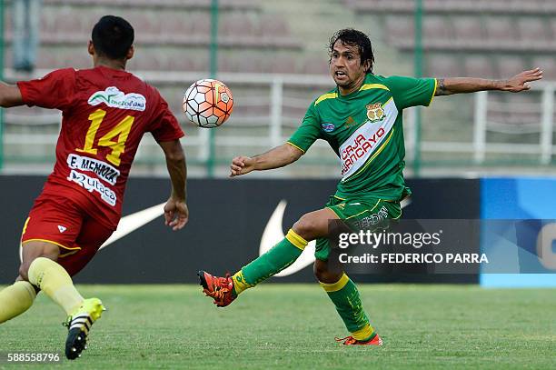 Victor Ferreira of Peru's Sport Huancayo, vies for ball with Edgar Mendoza of Venezuelas Deportivo Anzoategui, during their Copa Sudamericana 2016...